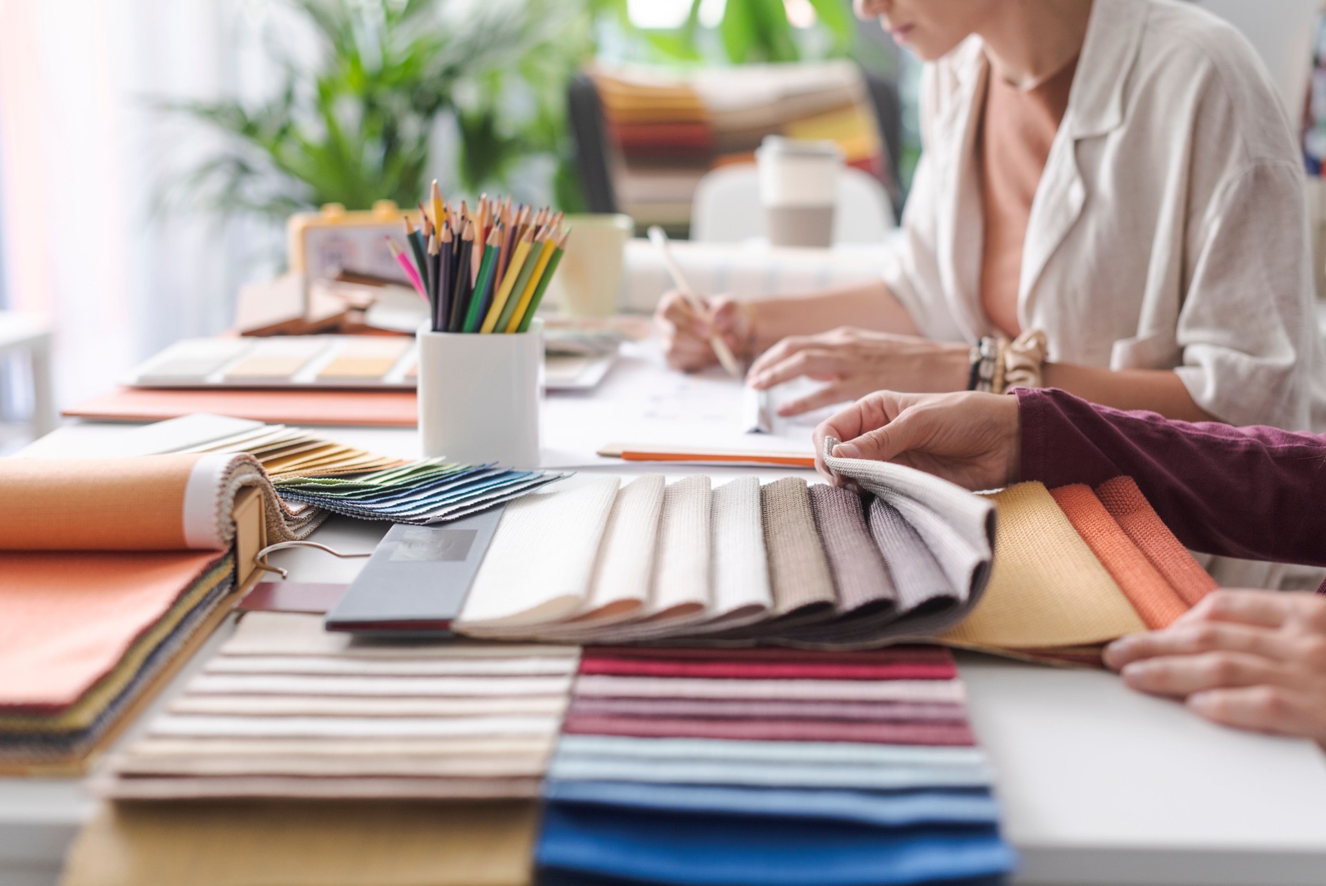 Interior designers checking fabric swatches